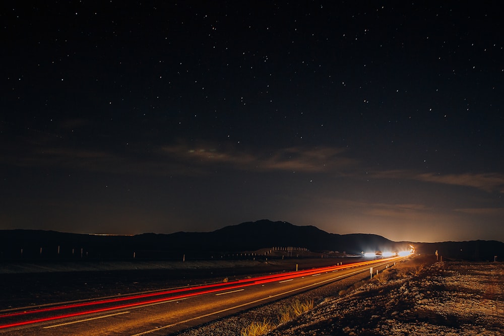 time lapse photography of road during night time