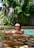 A satisfied customer standing next to their newly built pool.