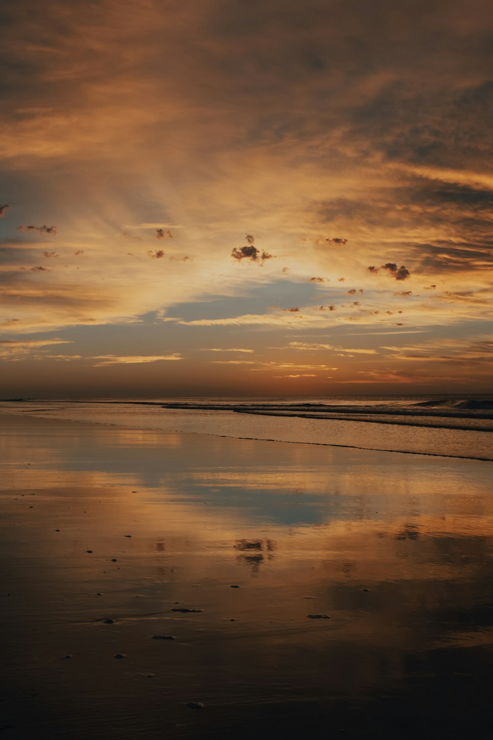 body of water during sunset