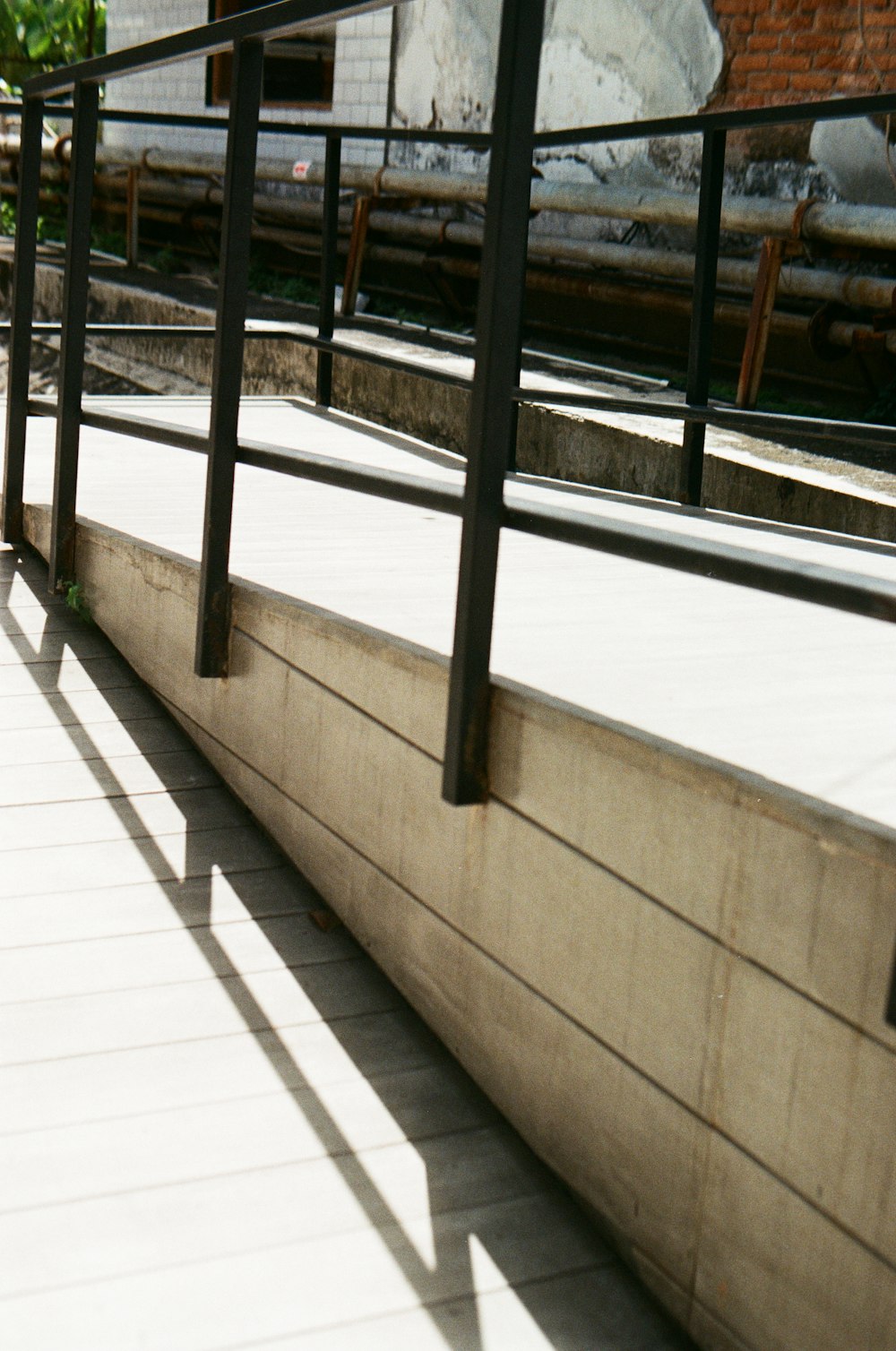 black metal railings on white floor tiles