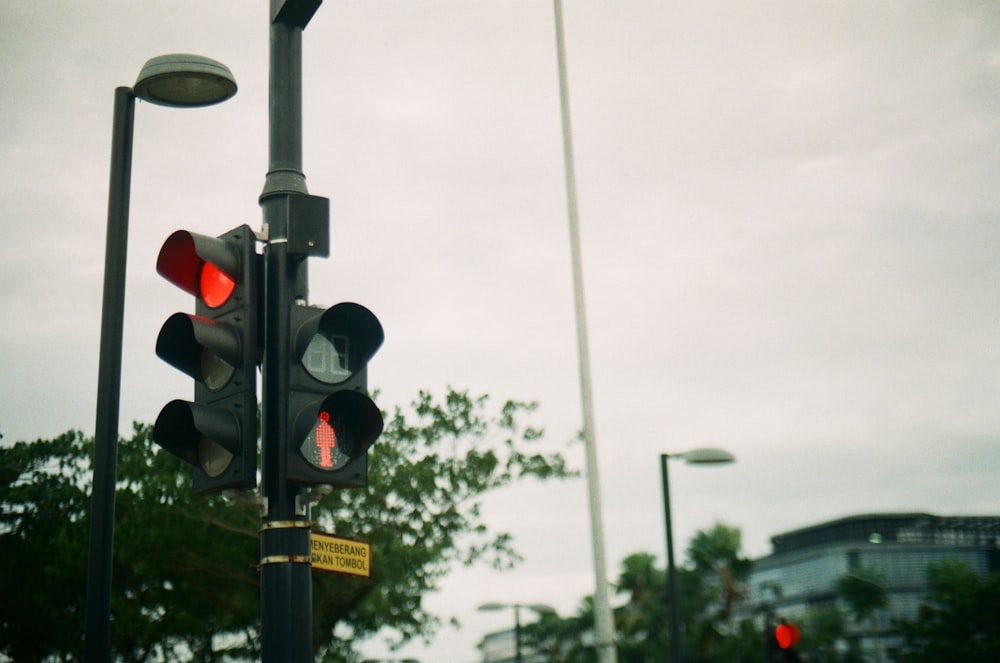 black traffic light with red light