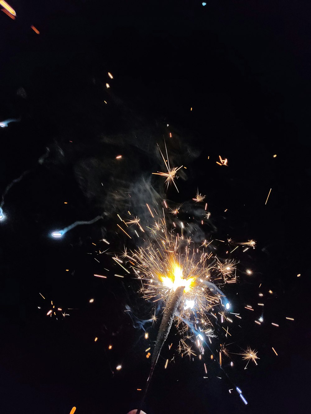 white and yellow fireworks during nighttime