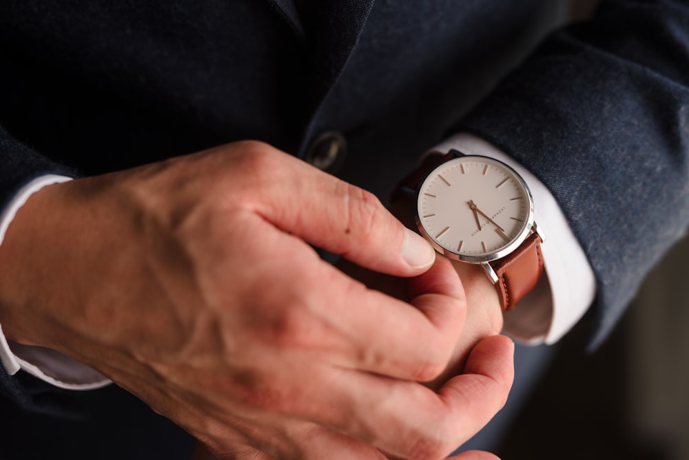 silver and white analog watch