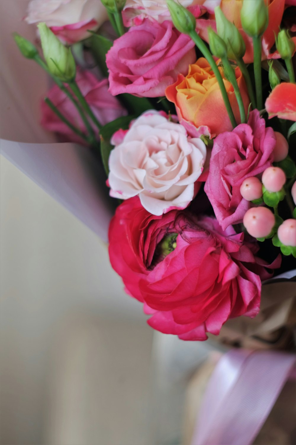 pink roses in white vase