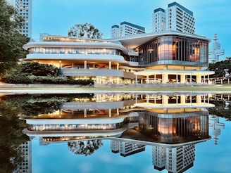A sleek corporate building in South Jakarta illuminated at dusk, reflecting the professionalism of Istana Krajaan Nusantara.
