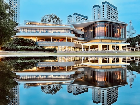 A sleek corporate building in South Jakarta illuminated at dusk, reflecting the professionalism of Istana Krajaan Nusantara.