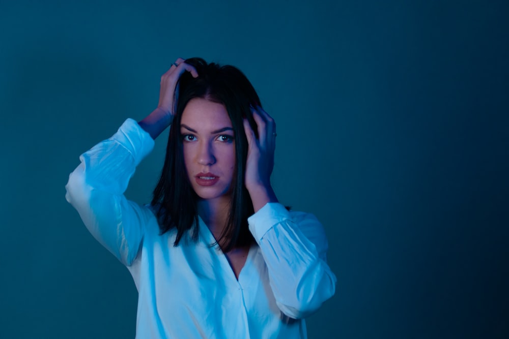 woman in blue long sleeve shirt