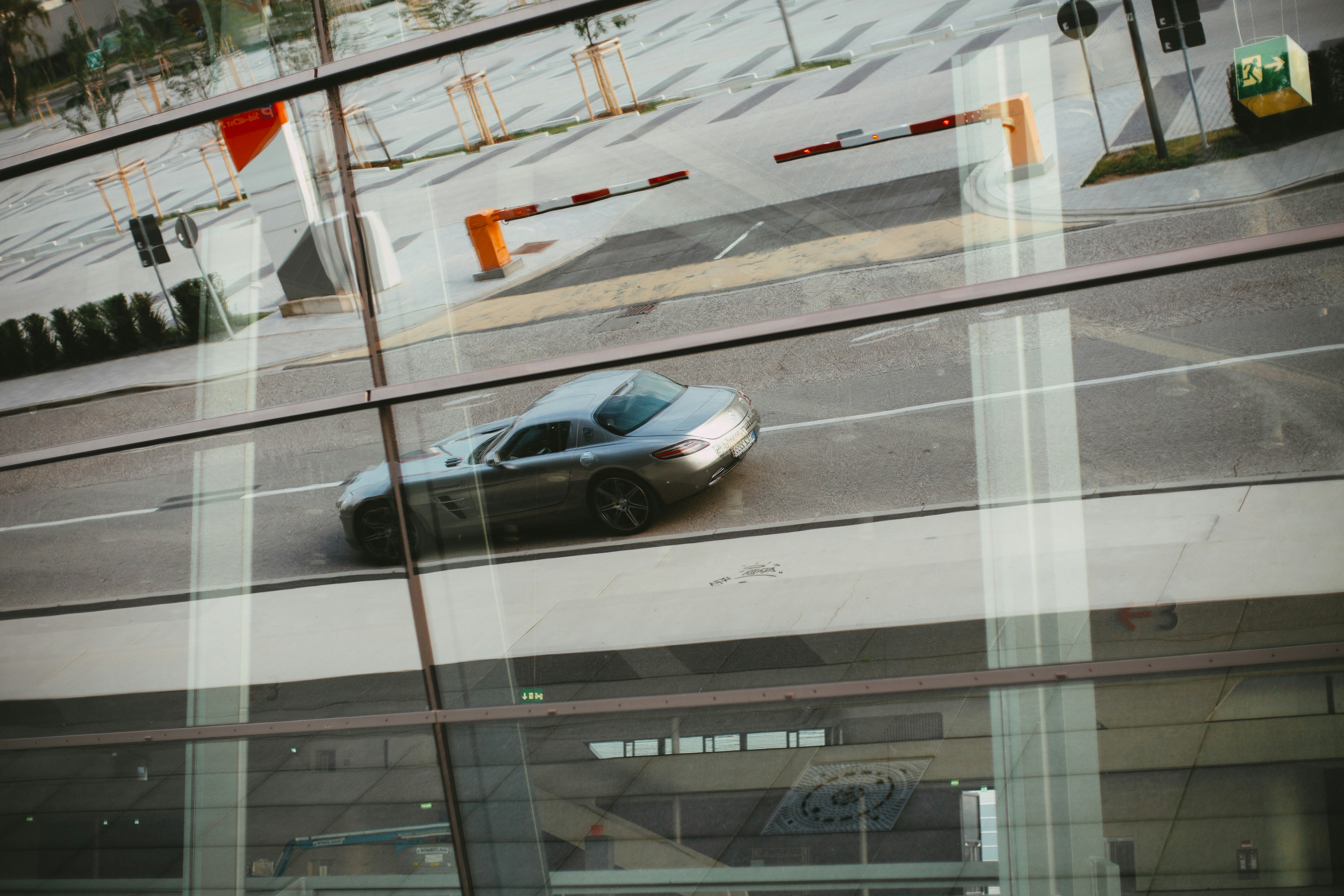 Glass reflection - Mercedes-Benz SLS AMG - Luxury Sports Car Gran-Turismo-Coupé. Made with analog vintage lens, Leica Summilux-R 1.4 50mm (Year: 1983)