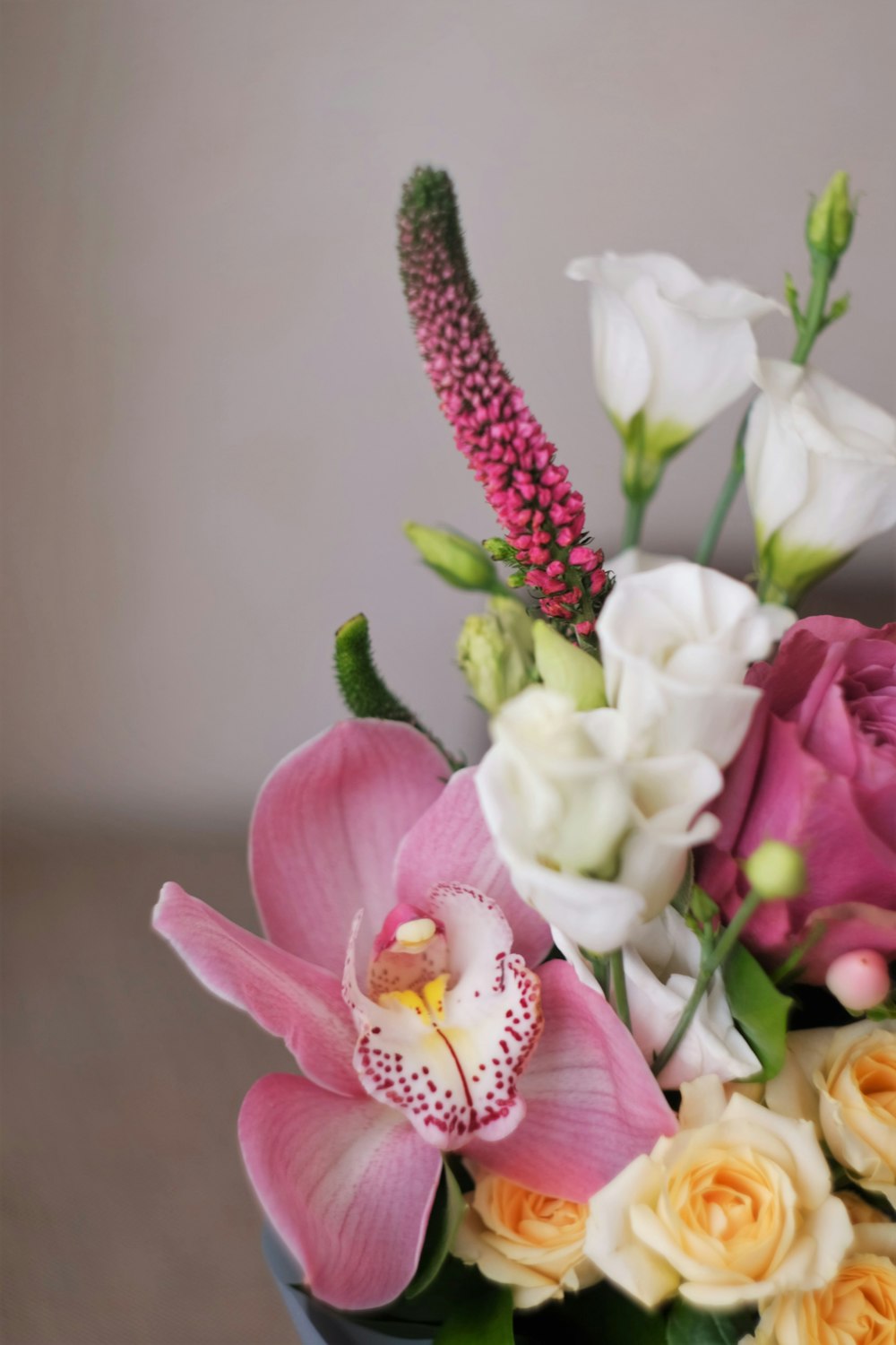 pink and white roses in brown basket