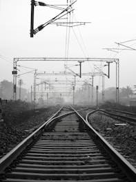 black metal train rail tracks