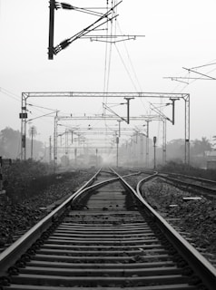 black metal train rail tracks