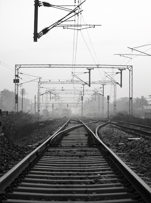 black metal train rail tracks