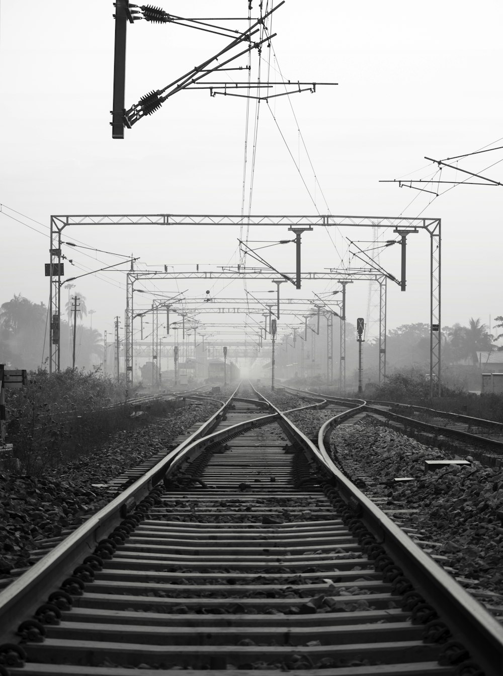 black metal train rail tracks