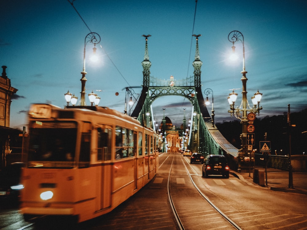 yellow tram on road during night time