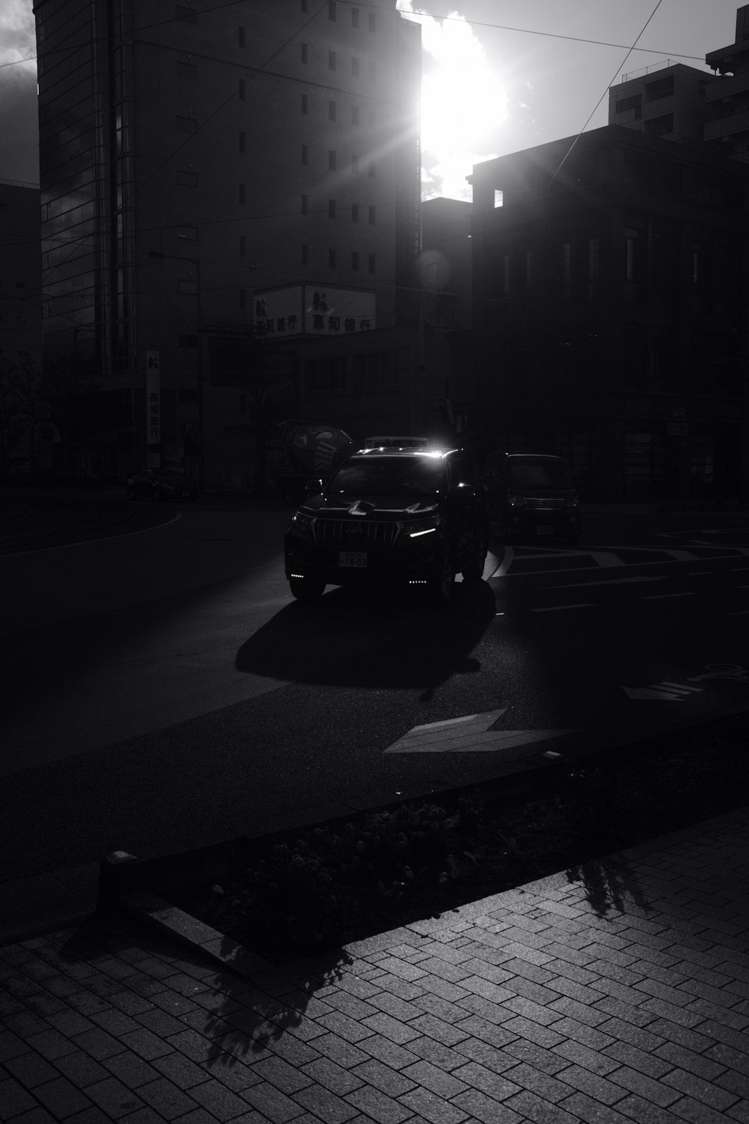 black car on road during night time