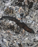 Close-up of soot and debris removed from inside a chimney flue.