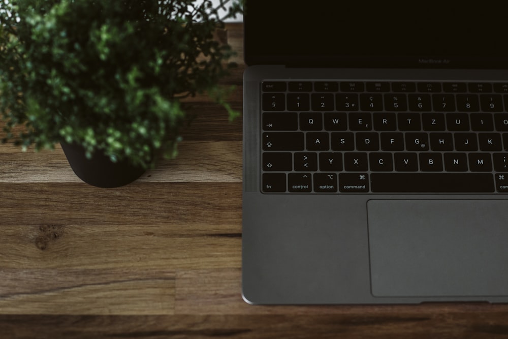 macbook pro on brown wooden table