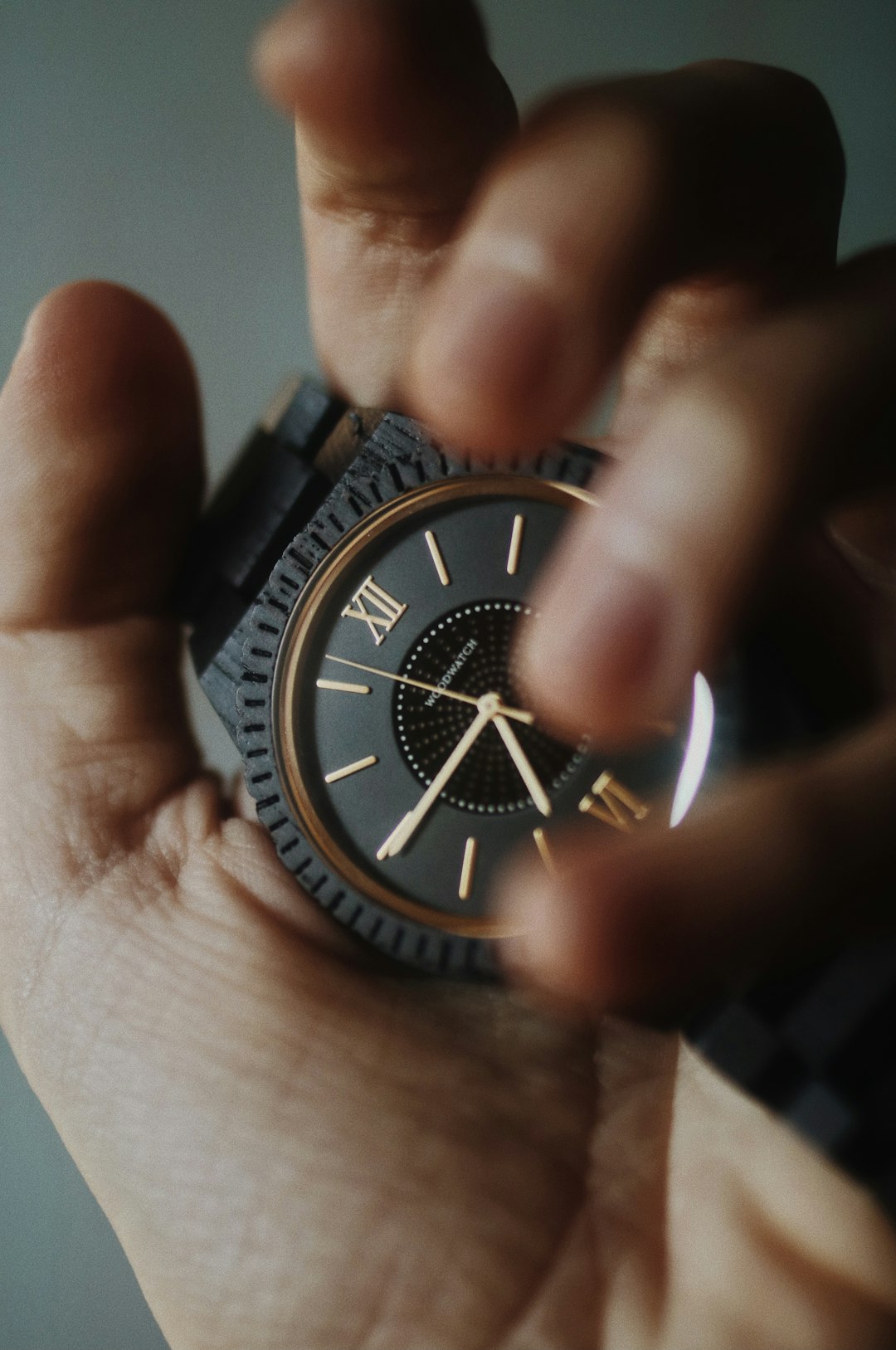 black and silver round analog watch