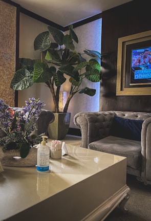 A cozy living room featuring a stylish air purifier beside a comfy armchair.