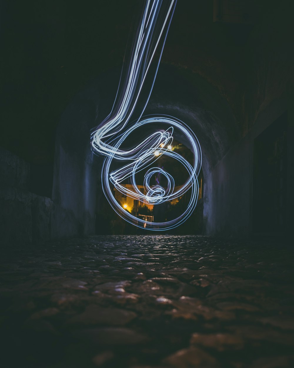 yellow light in tunnel during night time