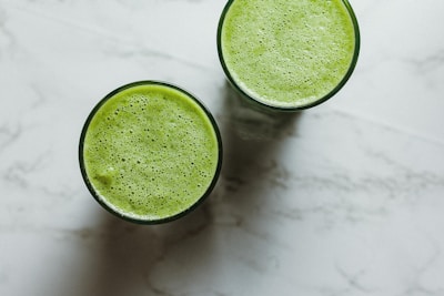 2 round green ceramic bowls