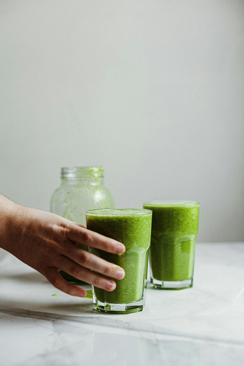 green liquid in clear glass jar