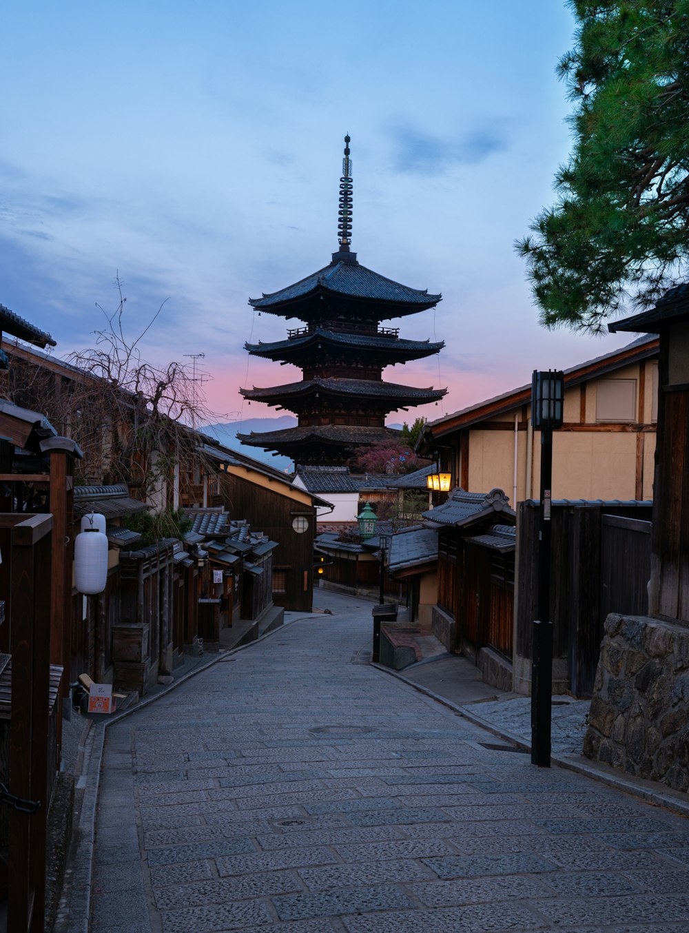 brown and black temple near trees during daytime