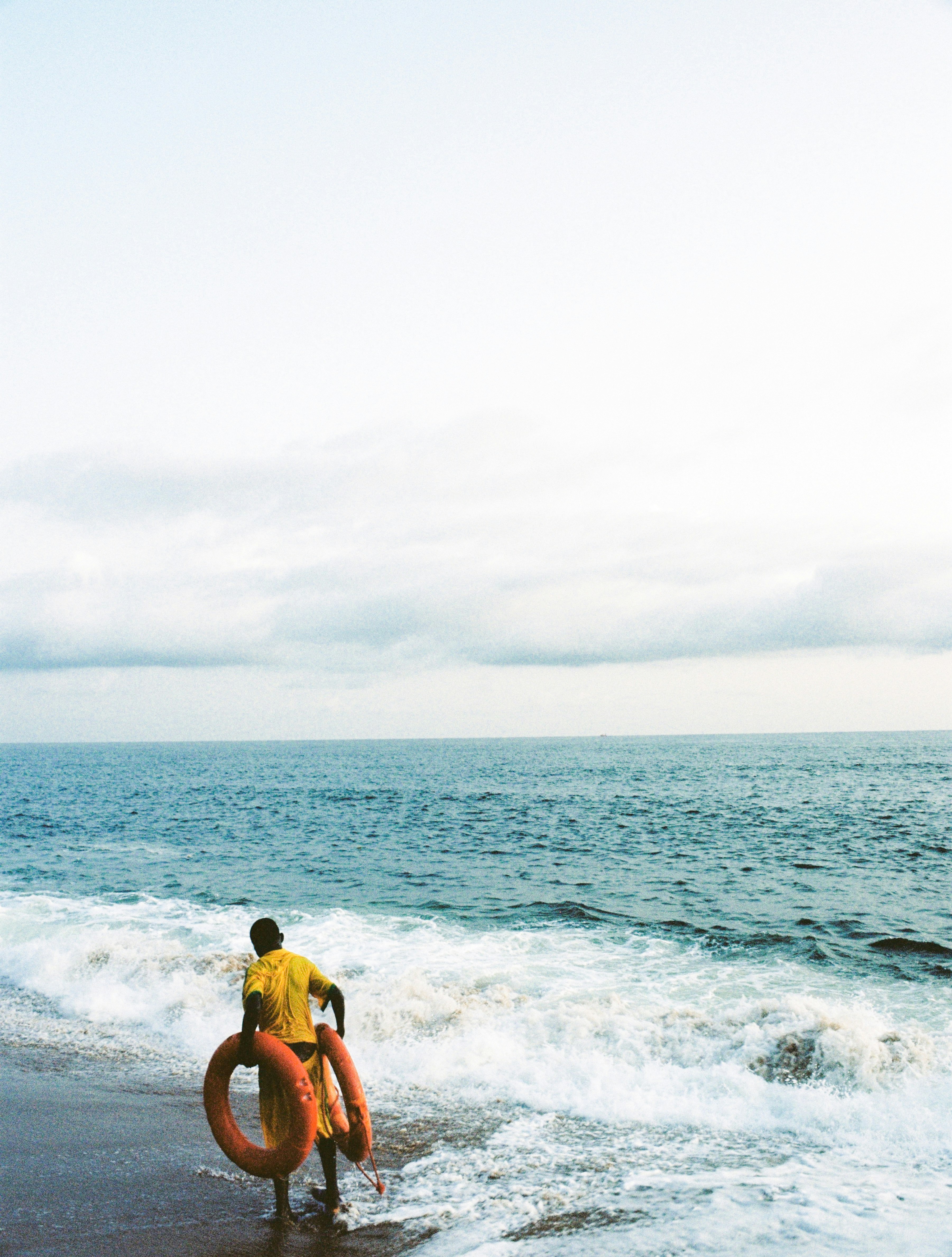 2 men in beach during daytime