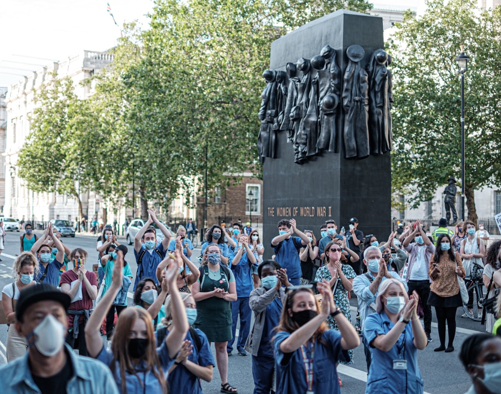 people gathering in the street during daytime