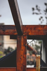 Close-up of handcrafted wooden panels used in building a patio pond.