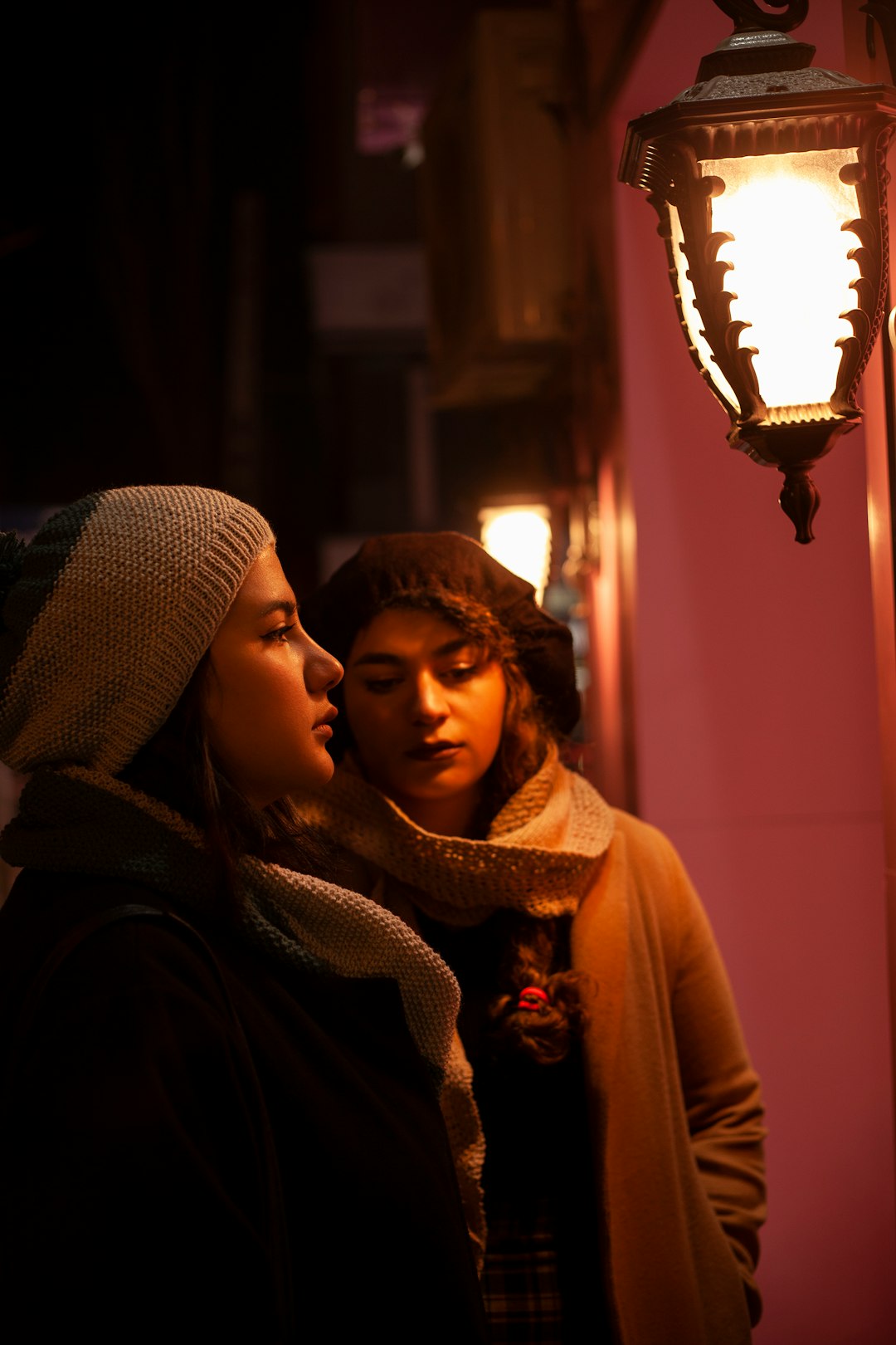 woman in brown hijab sitting beside woman in brown hijab