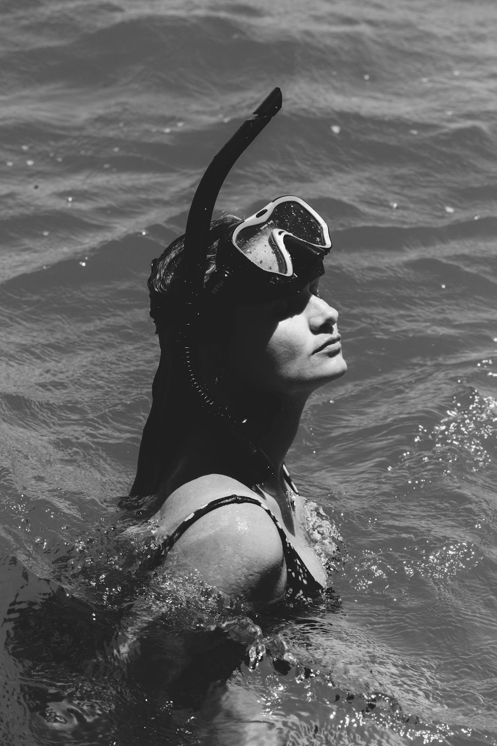 woman in black goggles in water