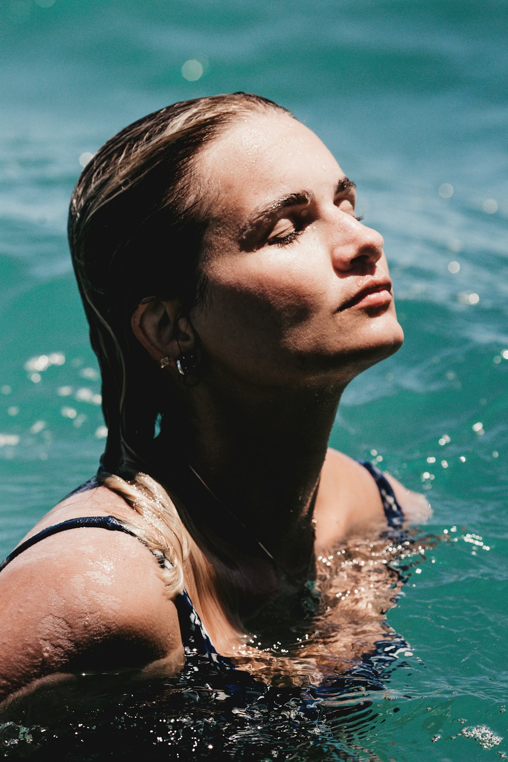 woman in white tank top in water