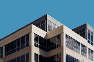 brown concrete building under blue sky during daytime