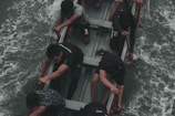 A group of volunteers working together on a boat.