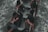 A group of people vigorously rowing a boat through rough waters, demonstrating teamwork and physical exertion.