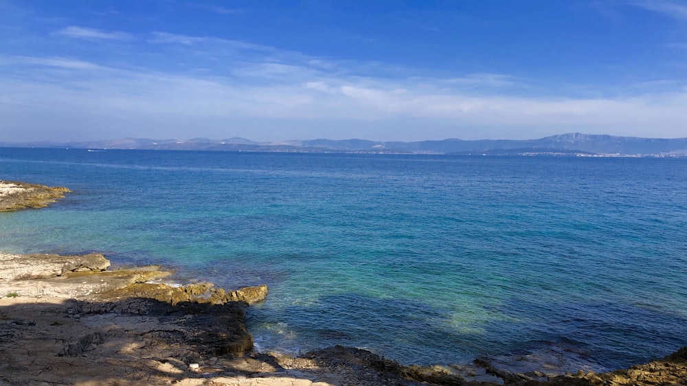 blue ocean water under blue sky during daytime