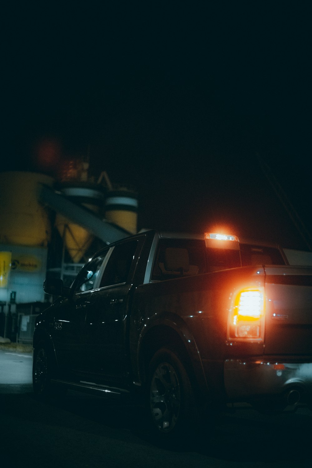 black car on road during night time