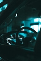 Close-up shot of a futuristic car dashboard glowing with blue ambient light.