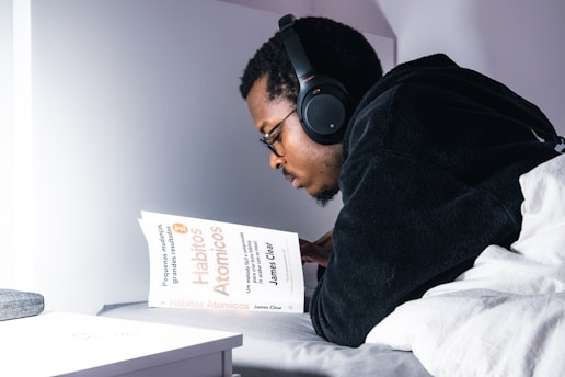 man in black jacket wearing black headphones