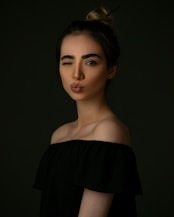 woman in black off shoulder dress