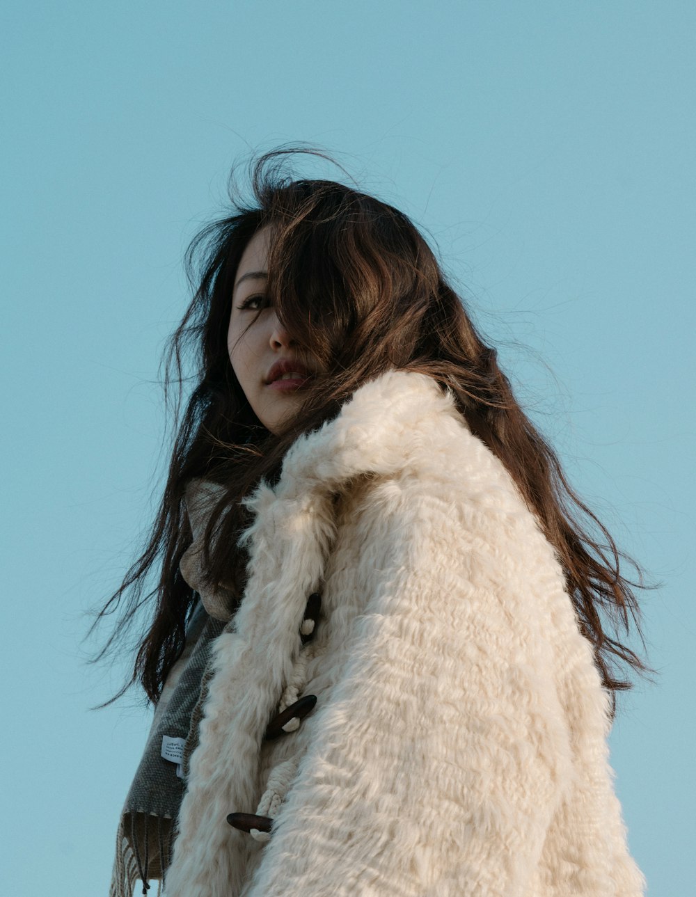 woman in white fur coat