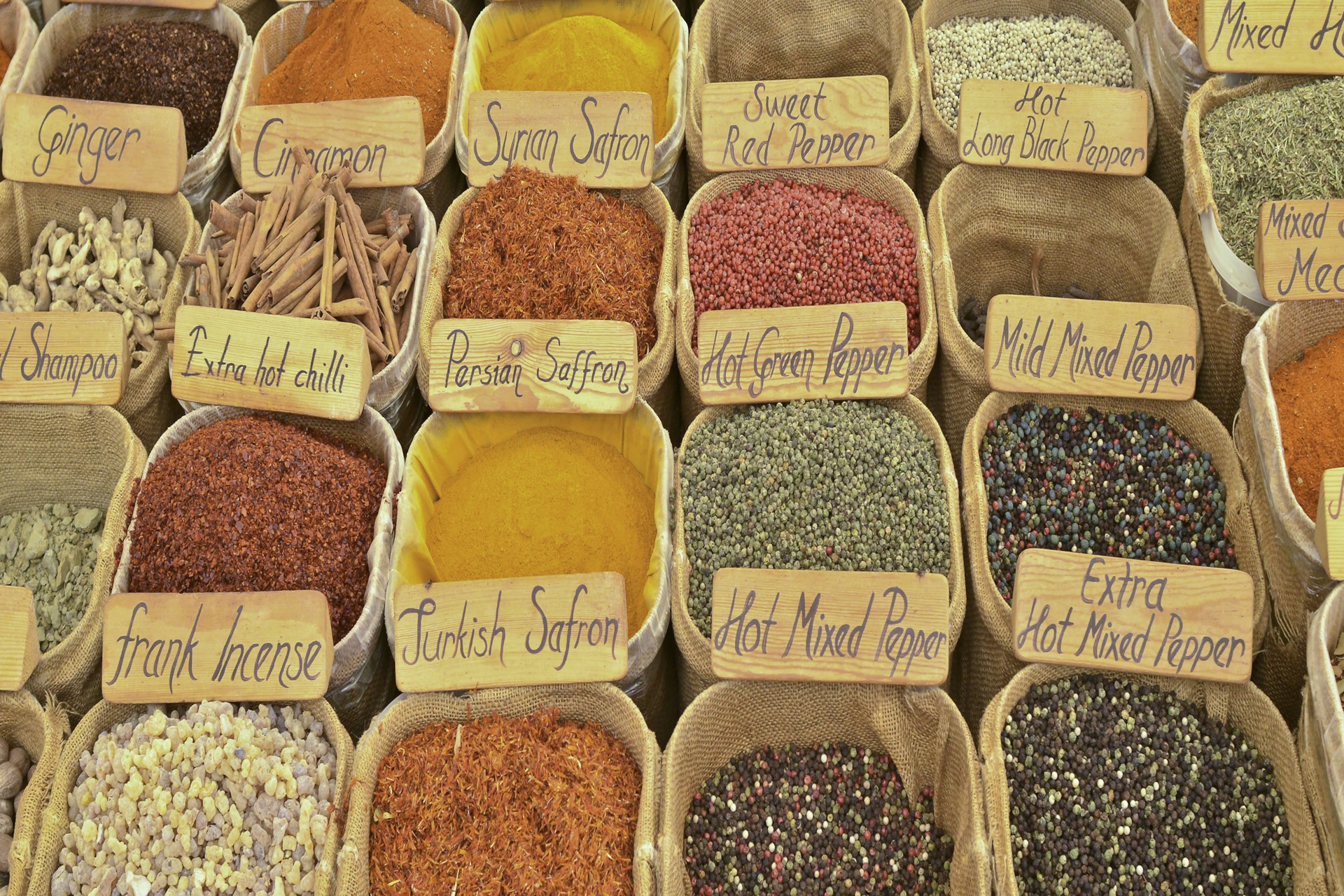assorted spices in brown plastic containers