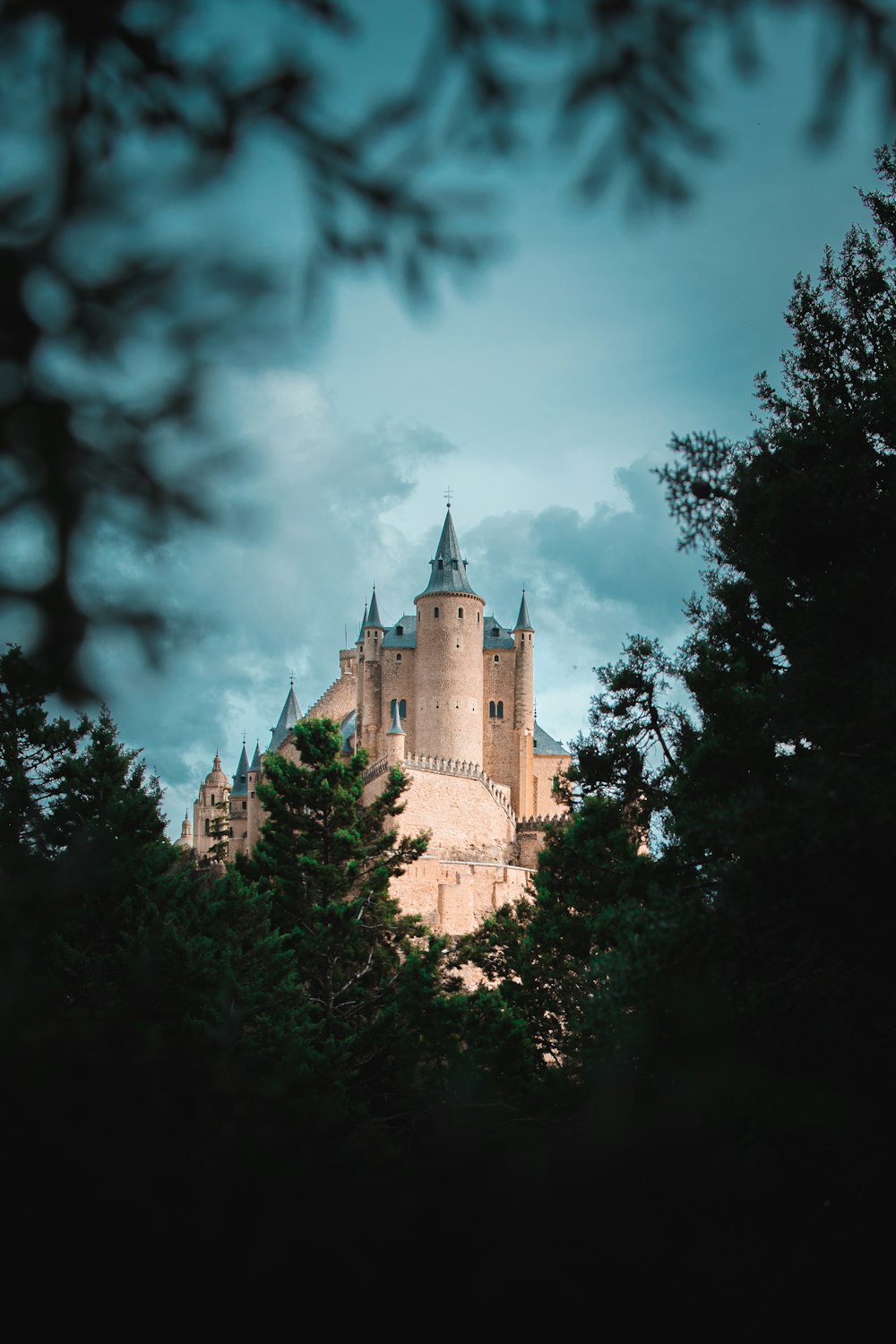 brown concrete castle under cloudy sky