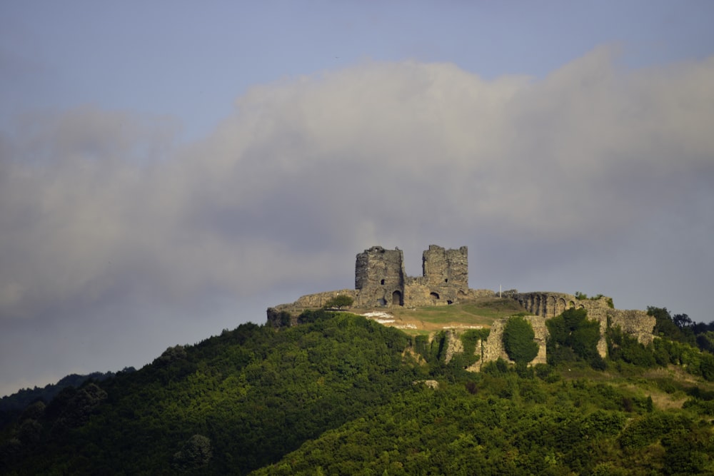 brown concrete building on top of mountain