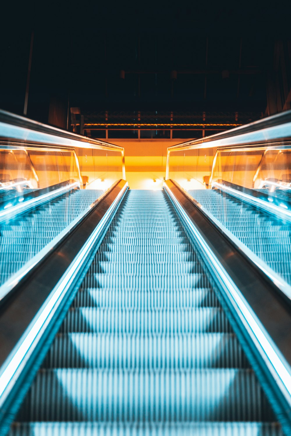 black and silver escalator in a train station