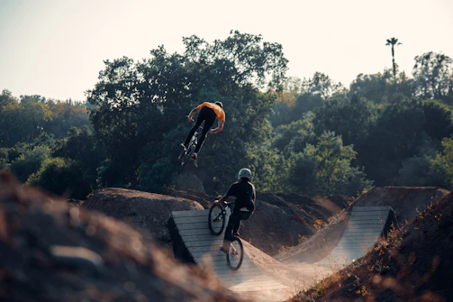 Riders practicing tricks together during a bright afternoon at Ruckstrack