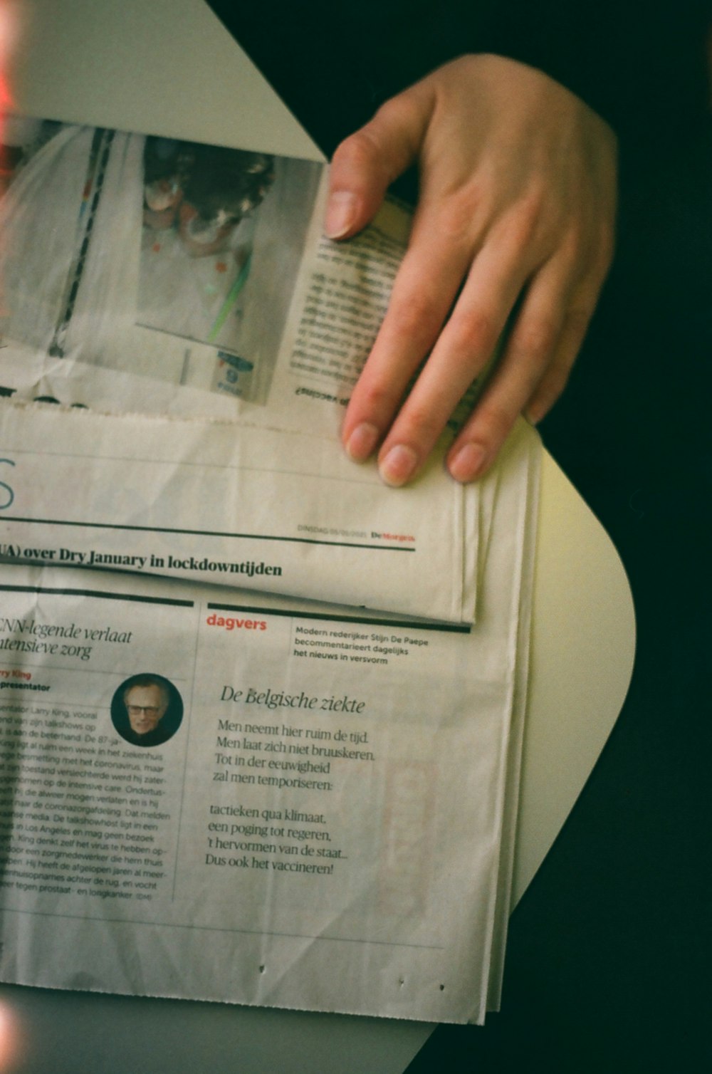 person holding white printer paper