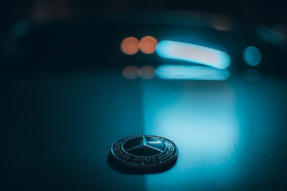 silver ring on blue surface