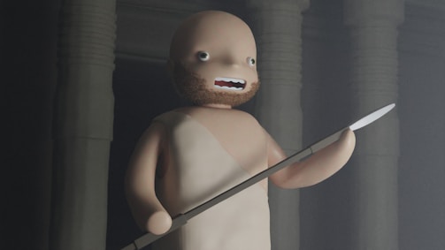 A stylized animated character with a simple facial expression stands holding a spear in one hand. The background features large, shadowy columns, creating an ancient or mystical atmosphere. The character has a bald head and a beard, wearing a basic one-shoulder garment.